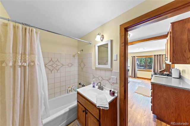 bathroom featuring hardwood / wood-style flooring, backsplash, vanity, and shower / bathtub combination with curtain