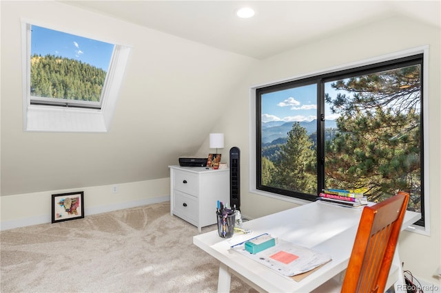 home office featuring lofted ceiling, light carpet, plenty of natural light, recessed lighting, and baseboards