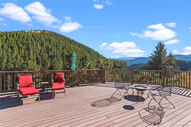 wooden deck featuring a mountain view