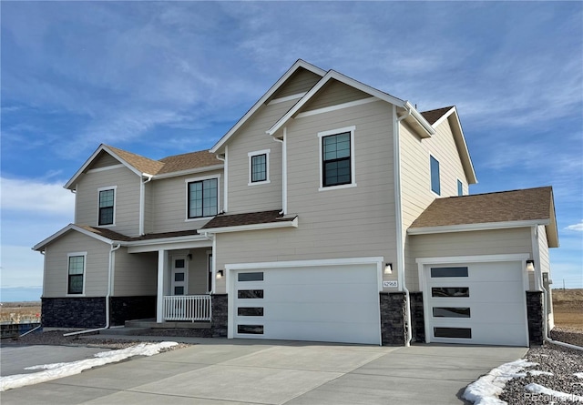 view of front of house featuring a garage and covered porch