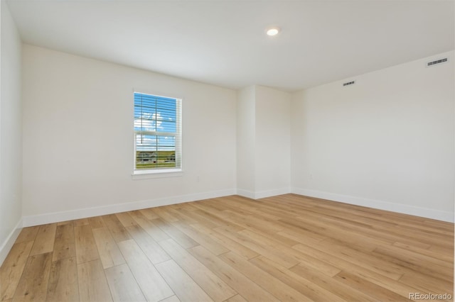 empty room with light wood-type flooring