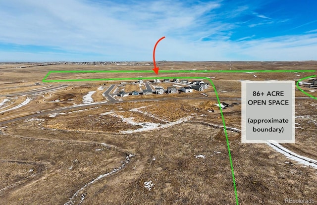 birds eye view of property featuring a rural view