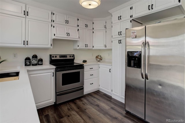 kitchen with sink, dark wood-type flooring, white cabinets, and appliances with stainless steel finishes