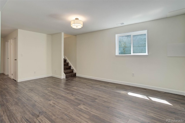 basement featuring dark hardwood / wood-style floors