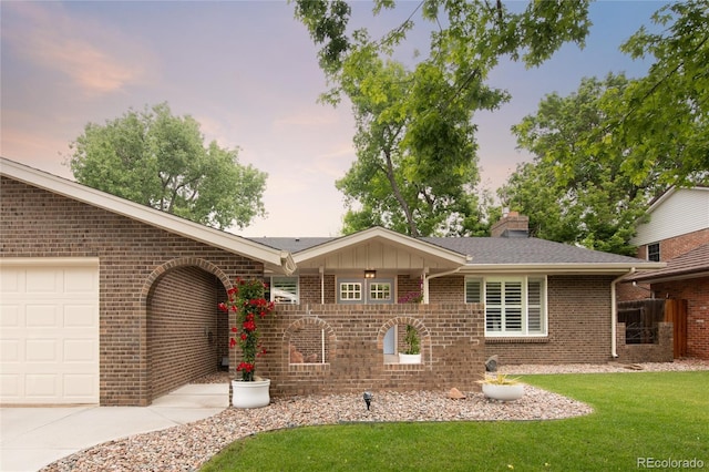 9861 E Ohio Ave, Denver, CO 80247 - single story home featuring brick siding, an attached garage, a yard, and a chimney