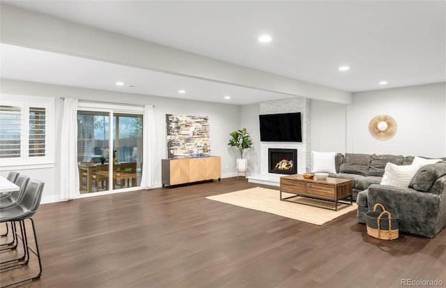 9861 E Ohio Ave, Denver, CO 80247 - living area featuring wood finished floors, recessed lighting, a large fireplace, and baseboards