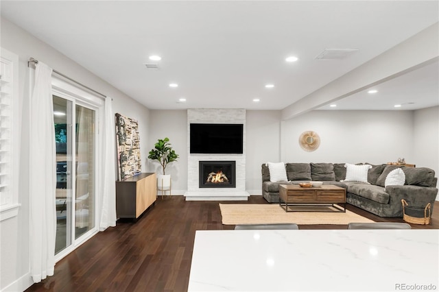9861 E Ohio Ave, Denver, CO 80247 - living area featuring dark wood-type flooring, recessed lighting, a fireplace, and baseboards