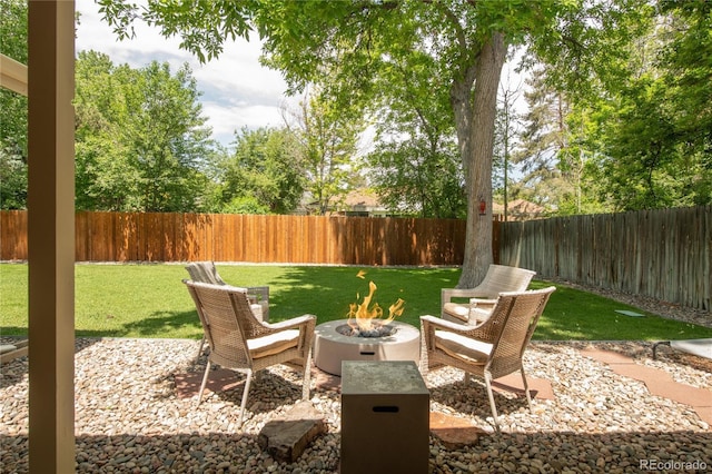 9861 E Ohio Ave, Denver, CO 80247 - view of patio / terrace with a fire pit