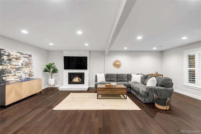 9861 E Ohio Ave, Denver, CO 80247 - living area with wood finished floors, baseboards, recessed lighting, and a large fireplace
