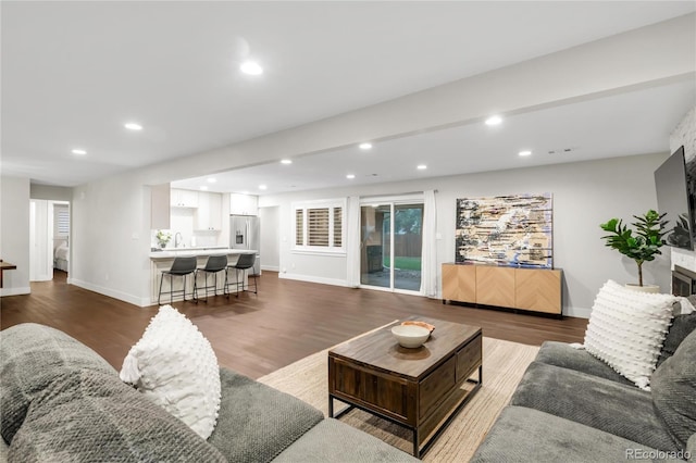 9861 E Ohio Ave, Denver, CO 80247 - living area with dark wood-style flooring, recessed lighting, and baseboards