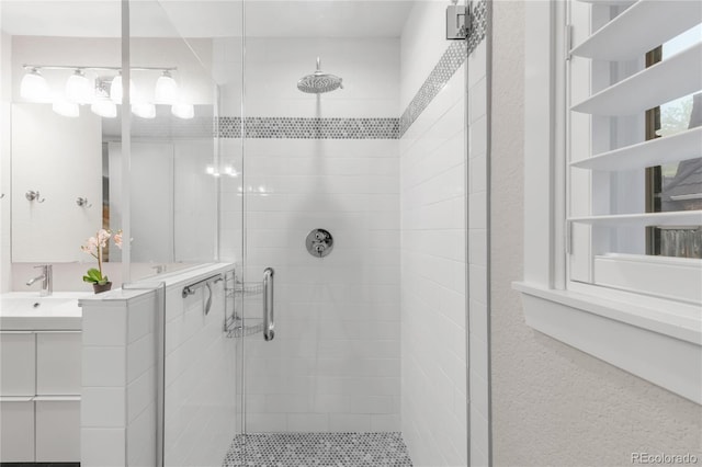 9861 E Ohio Ave, Denver, CO 80247 - bathroom with a shower stall and vanity