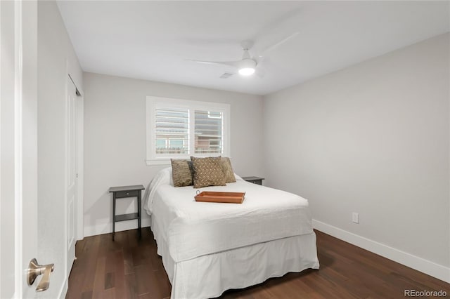 9861 E Ohio Ave, Denver, CO 80247 - bedroom with dark wood finished floors, baseboards, ceiling fan, and a closet