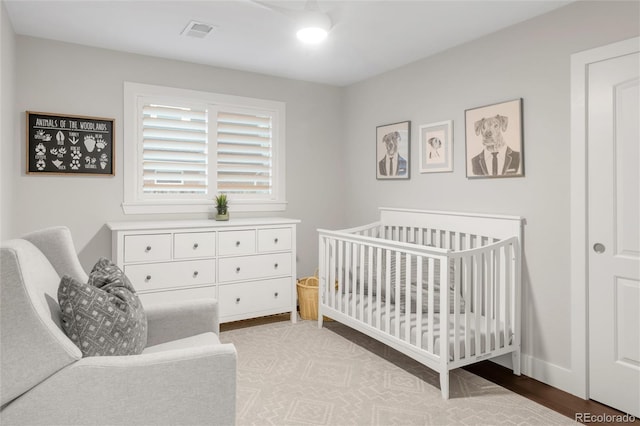 9861 E Ohio Ave, Denver, CO 80247 - bedroom with a nursery area and baseboards