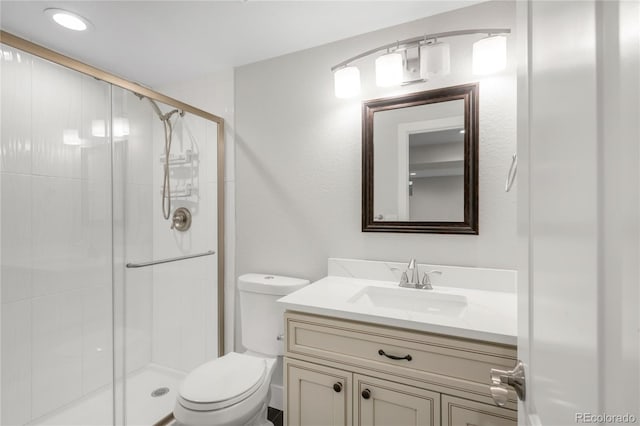 9861 E Ohio Ave, Denver, CO 80247 - bathroom featuring toilet, vanity, and a stall shower