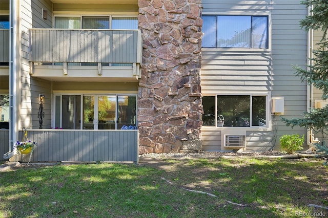 3365 Chisholm Trl Unit B102, Boulder, CO 80301 - rear view of property featuring a balcony and a yard