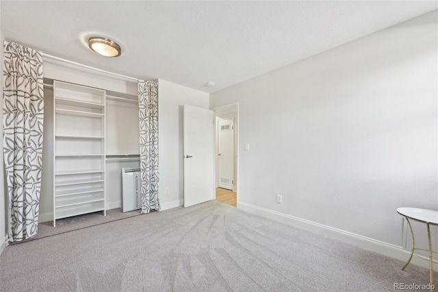 3365 Chisholm Trl Unit B102, Boulder, CO 80301 - unfurnished bedroom with carpet floors, baseboards, and a closet