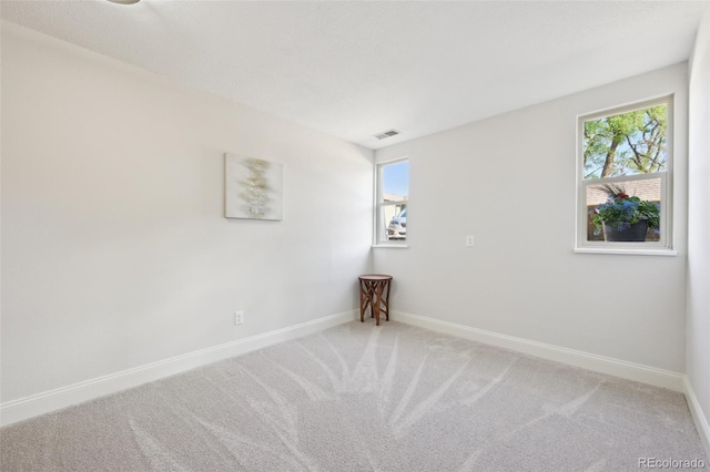 3365 Chisholm Trl Unit B102, Boulder, CO 80301 - carpeted empty room featuring healthy amount of natural light and baseboards