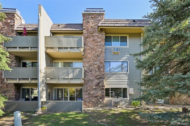 3365 Chisholm Trl Unit B102, Boulder, CO 80301 - back of house featuring a balcony and a chimney