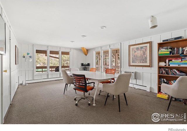 3365 Chisholm Trl Unit B102, Boulder, CO 80301 - carpeted dining room featuring baseboard heating, a decorative wall, and a wall mounted air conditioner