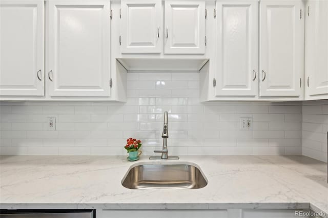 3365 Chisholm Trl Unit B102, Boulder, CO 80301 - kitchen with white cabinets, tasteful backsplash, and light stone countertops
