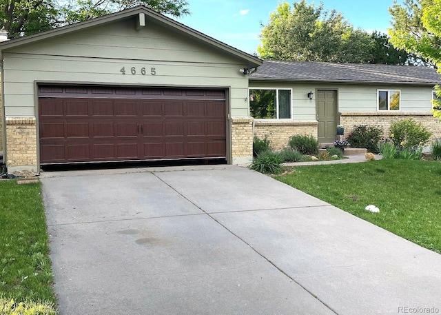 4665 E Peakview Ave, Centennial, CO 80121 - single story home with brick siding, a front yard, driveway, and a garage