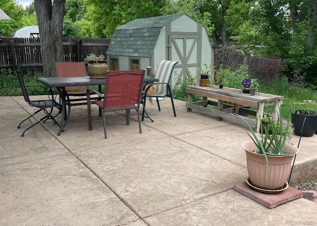 4665 E Peakview Ave, Centennial, CO 80121 - view of patio / terrace with outdoor dining space and a storage shed