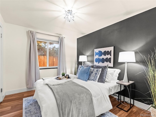 3555 Leyden St, Denver, CO 80207 - bedroom with wood finished floors and baseboards