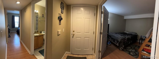 corridor featuring light hardwood / wood-style flooring