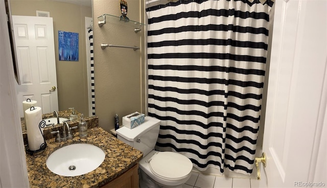 bathroom featuring vanity, toilet, and curtained shower