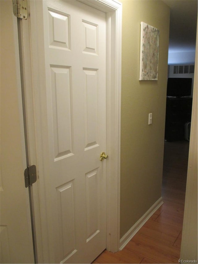 hall featuring wood-type flooring