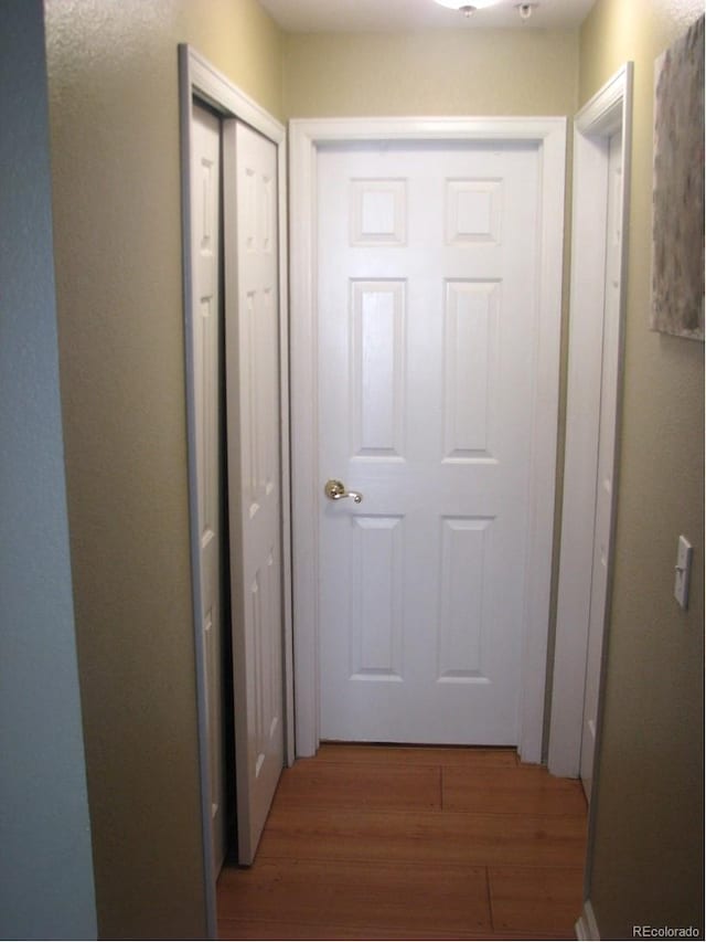 corridor featuring dark hardwood / wood-style floors