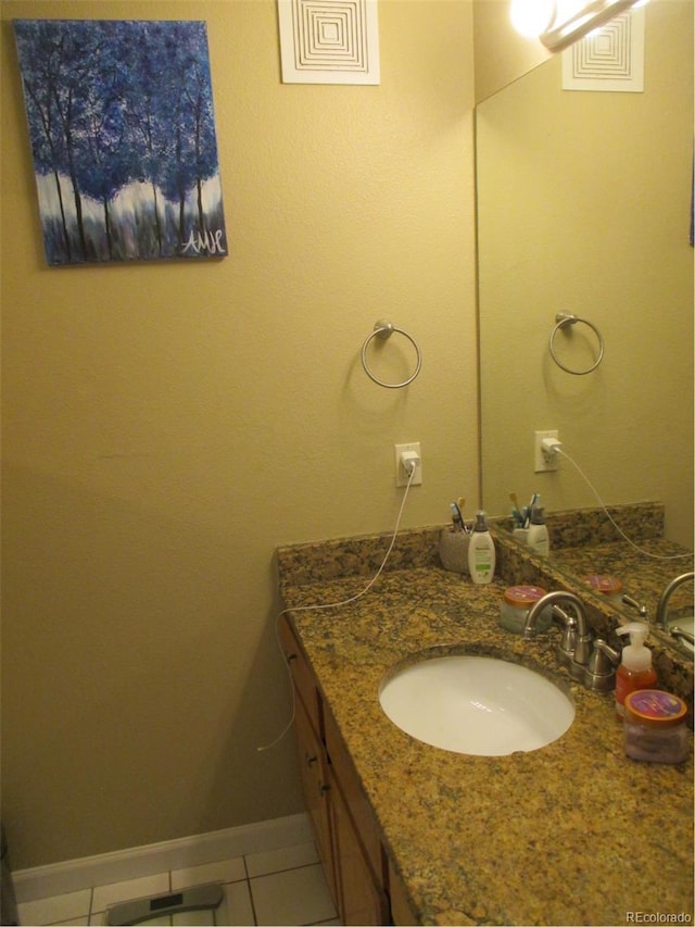 bathroom featuring tile patterned flooring and vanity