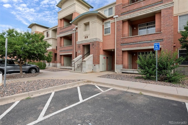 4100 Albion St Unit 320, Denver, CO 80216 - view of property featuring uncovered parking