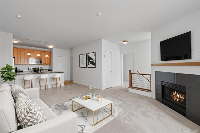 4100 Albion St Unit 320, Denver, CO 80216 - living area with a tile fireplace and baseboards