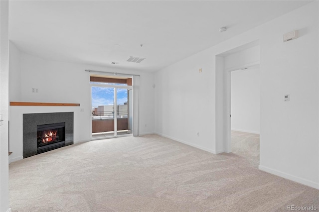 4100 Albion St Unit 320, Denver, CO 80216 - unfurnished living room with a glass covered fireplace and carpet floors