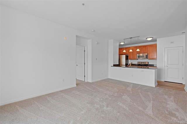 4100 Albion St Unit 320, Denver, CO 80216 - unfurnished living room with light colored carpet and rail lighting
