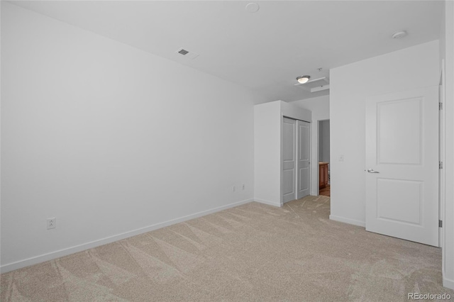 4100 Albion St Unit 320, Denver, CO 80216 - unfurnished bedroom with light colored carpet and a closet