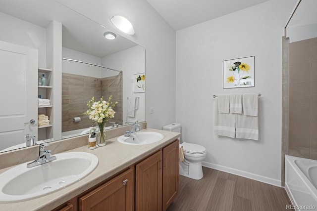 4100 Albion St Unit 320, Denver, CO 80216 - bathroom with double vanity, wood finished floors, and shower / bathtub combination