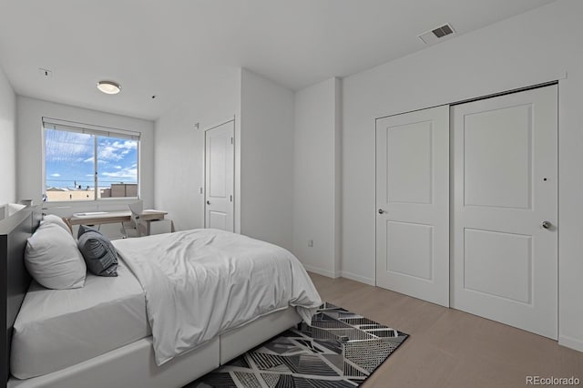 4100 Albion St Unit 320, Denver, CO 80216 - bedroom with light wood-style flooring and baseboards