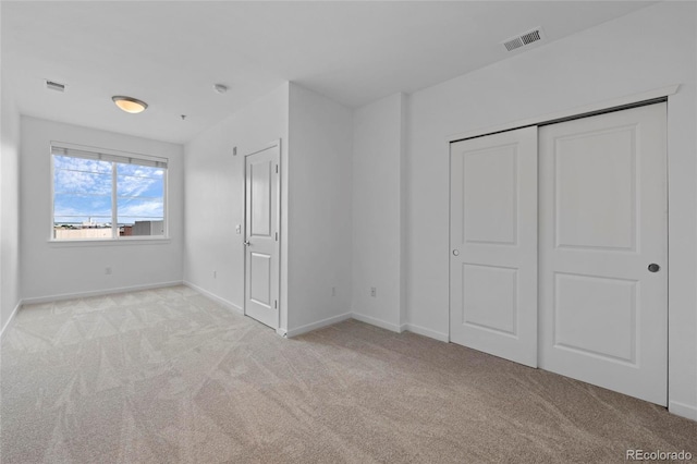 4100 Albion St Unit 320, Denver, CO 80216 - unfurnished bedroom featuring carpet flooring and a closet