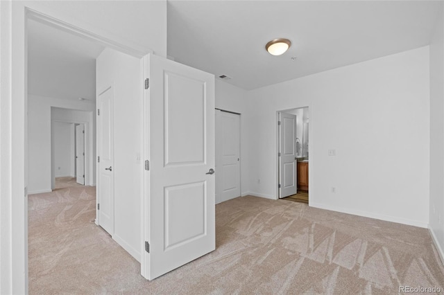 4100 Albion St Unit 320, Denver, CO 80216 - unfurnished bedroom with carpet floors and ensuite bathroom