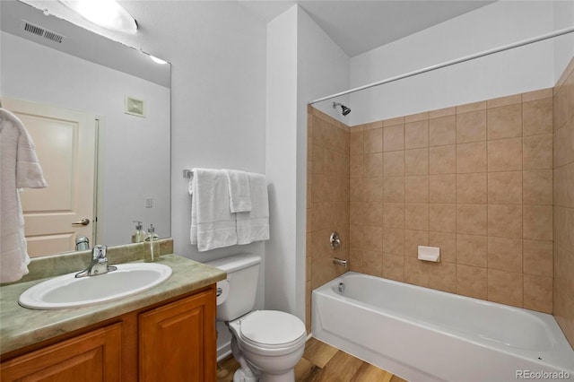 4100 Albion St Unit 320, Denver, CO 80216 - bathroom featuring vanity, tub / shower combination, and wood finished floors