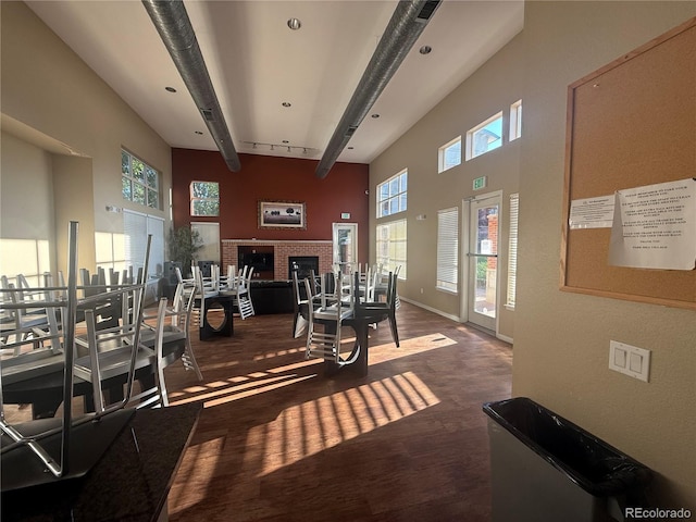 4100 Albion St Unit 320, Denver, CO 80216 - dining space featuring a towering ceiling, wood finished floors, and beamed ceiling