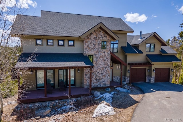 632 Gcr 662, Grand Lake, CO 80447 - view of front facade with a garage, aphalt driveway, roof with shingles, and stone siding