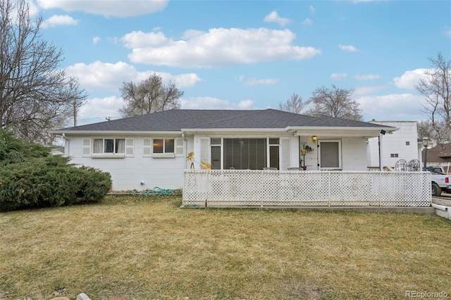 back of house with a lawn and a porch