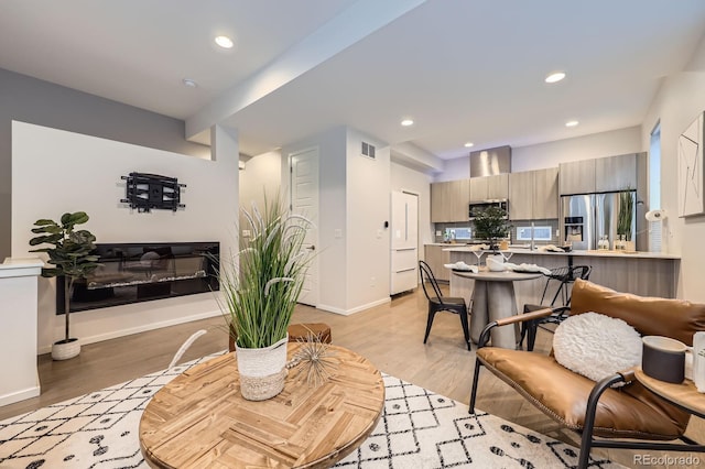 3256 Federal Blvd, Denver, CO 80211 - living room with baseboards, light wood-type flooring, and recessed lighting