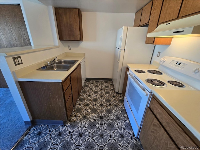 kitchen with under cabinet range hood, white appliances, a sink, baseboards, and light countertops