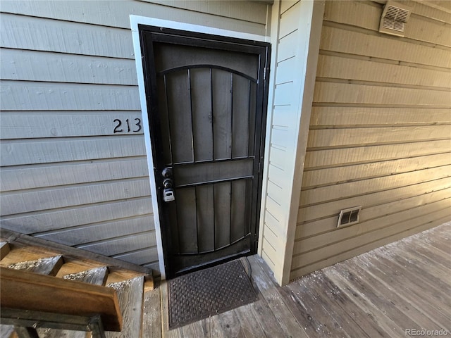 property entrance featuring visible vents