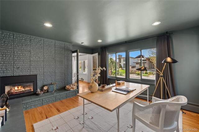 office featuring a large fireplace, plenty of natural light, and recessed lighting