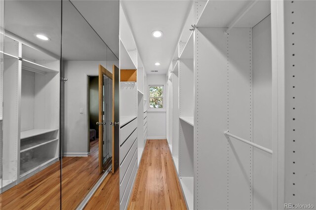 spacious closet with light wood-style floors